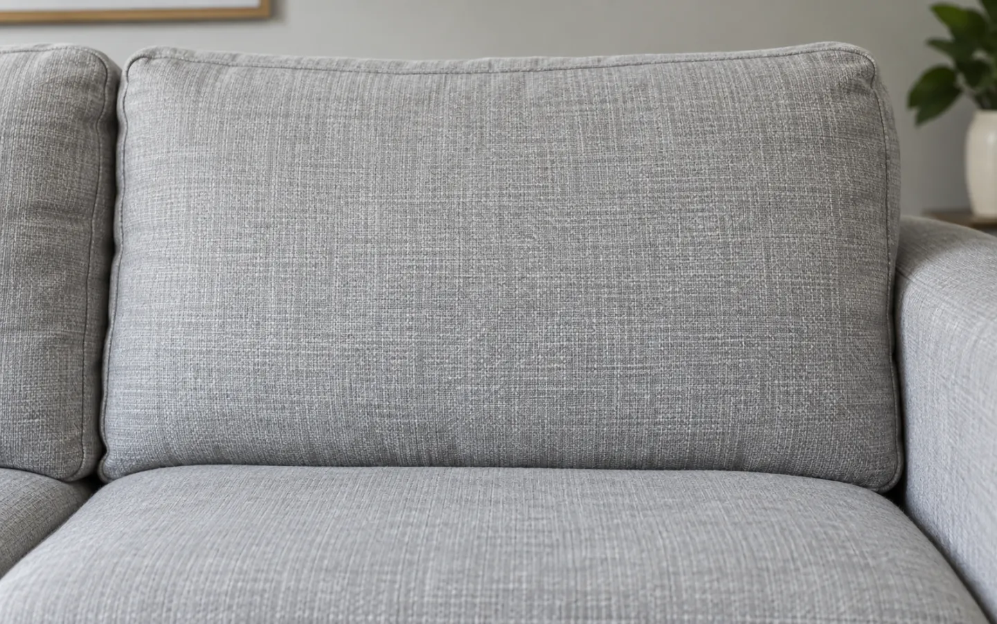 A stained fabric cushion before cleaning and the same cushion after